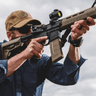 Magpul PMAG 30 AR/M4 Gen M3 Coyote Tan Magazine inserted in AR-15 rifle Magpul PMAG 30 AR/M4 Gen M3 Coyote Tan Magazine inserted in AR-15 rifle